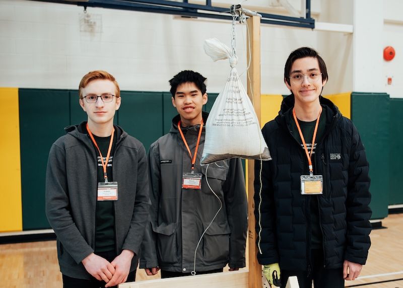 Overall winning team from DP Todd Secondary School pose next to their designed apparatus.