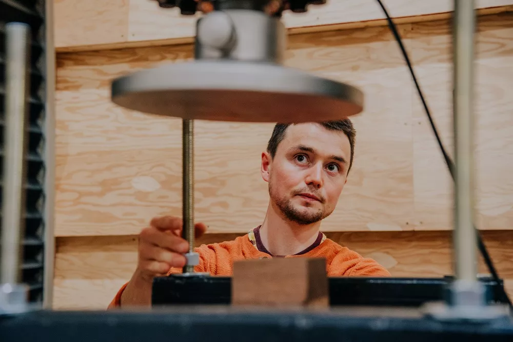A student conducts research at the Wood Innovation Research Lab