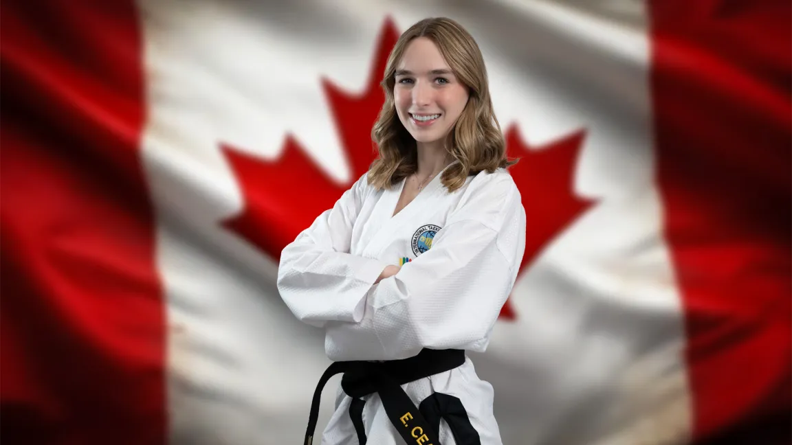 Person in a taekowndo kit standing in front of a Canadian flag