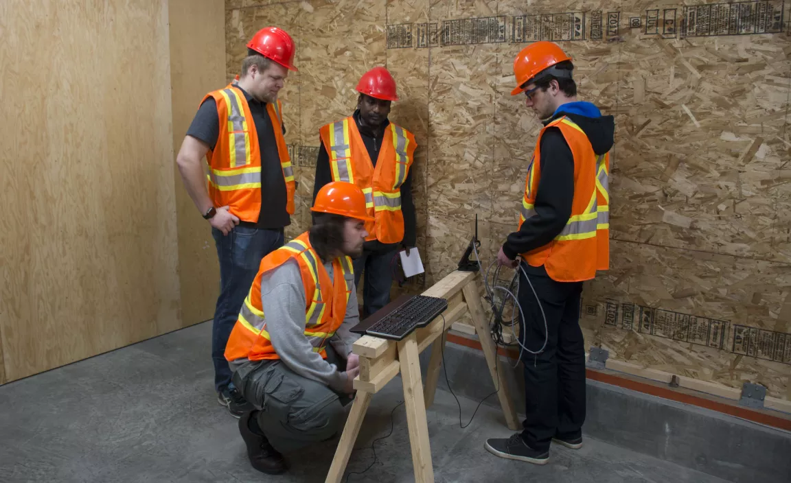 Students and faculty members working on sensors at the Wood Innovation Research Lab.