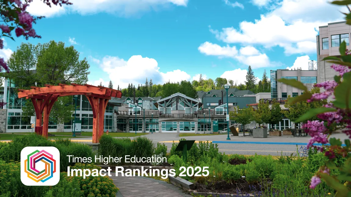 Exterior view of UNBC's Agora Courtyard with garden in foreground.