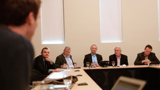 Senators listen to a question at UNBC event.