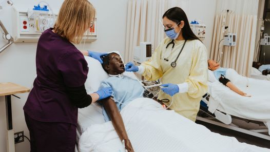 An instructor and student in UNBC's nursing lab at the Prince George campus.