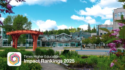 Exterior view of UNBC's Agora Courtyard with garden in foreground.