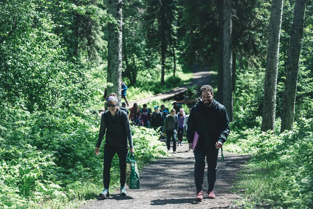People walking through UNBC Greenway forest