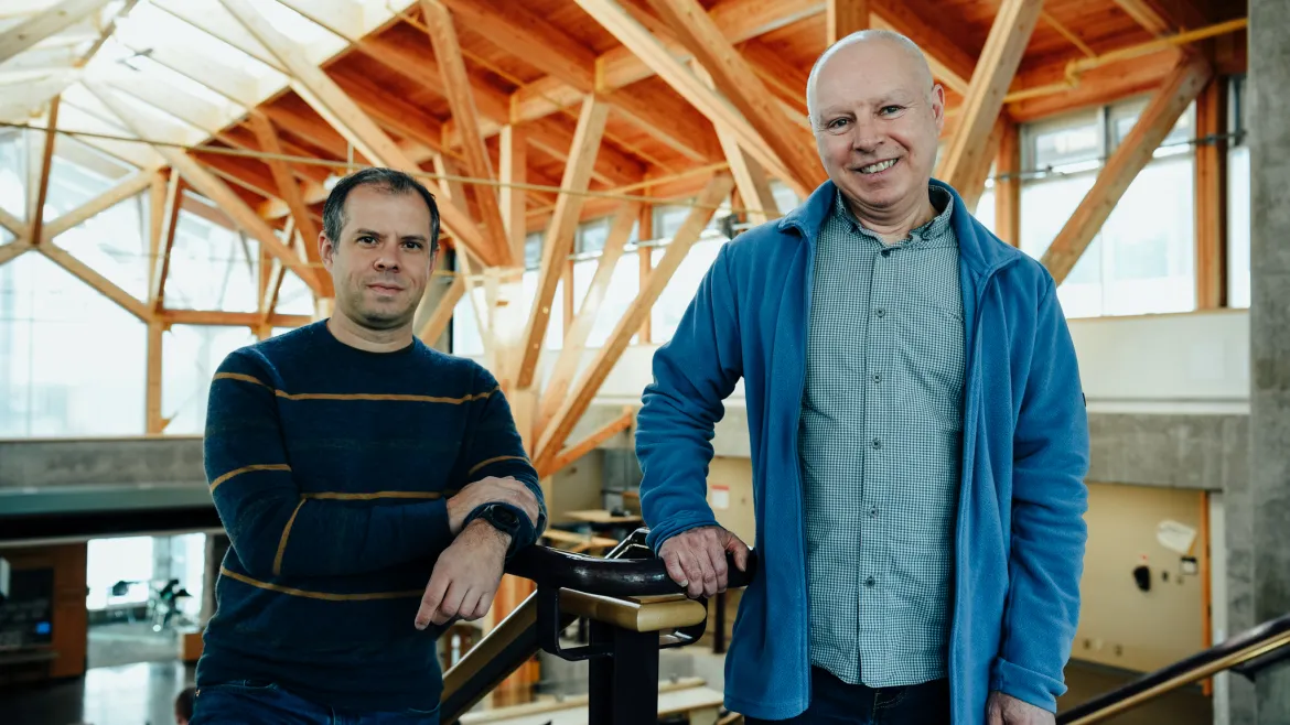 Two people in the Canfor Winter Garden at UNBC