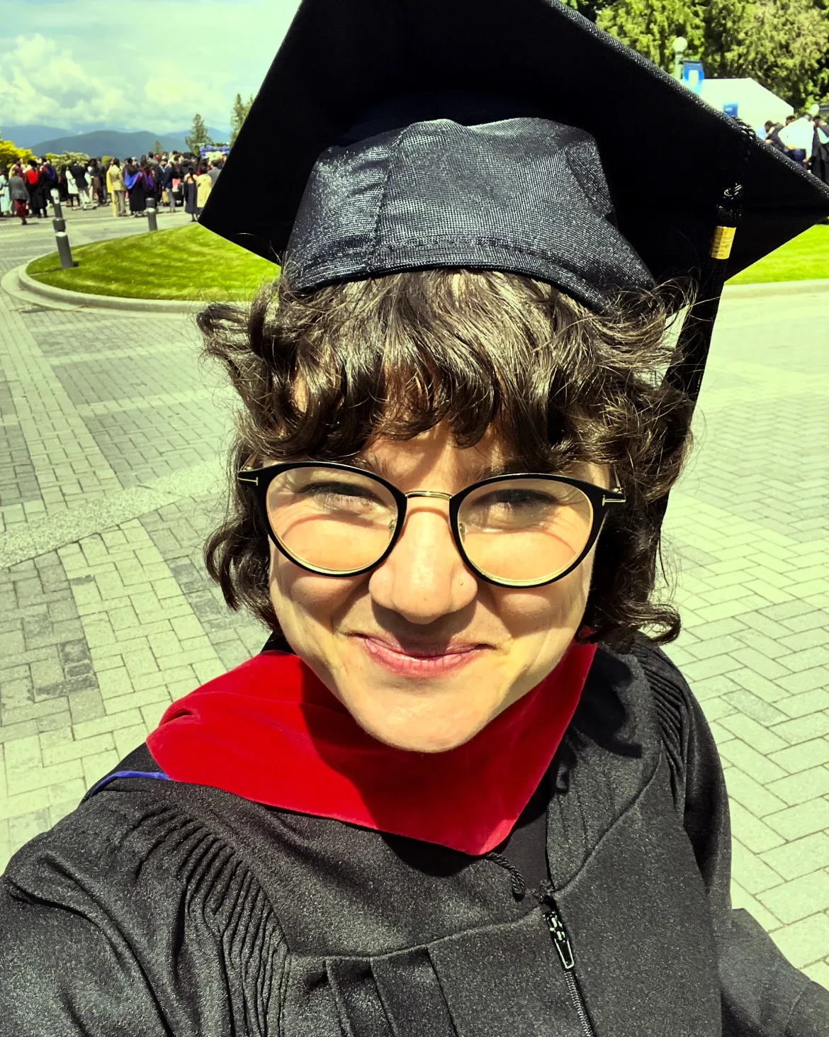 Michaela Kelly in a black grad gown and cap