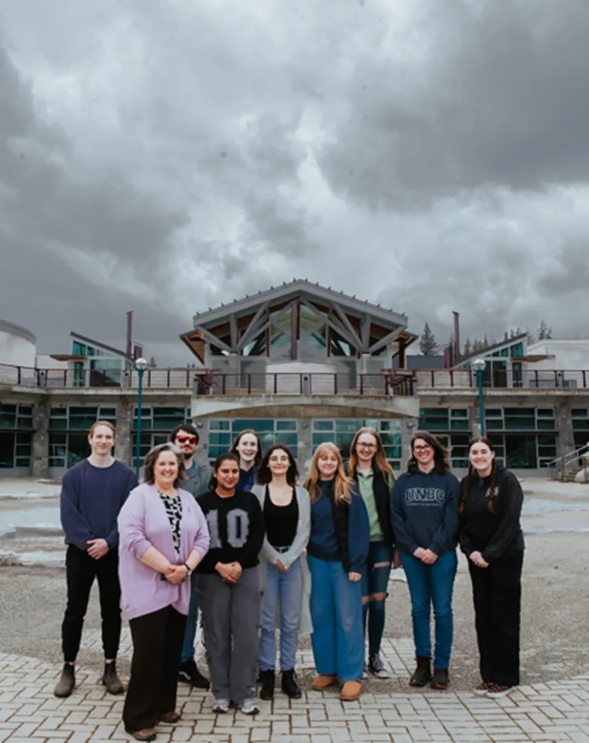 Group of people standing together at UNBC campus