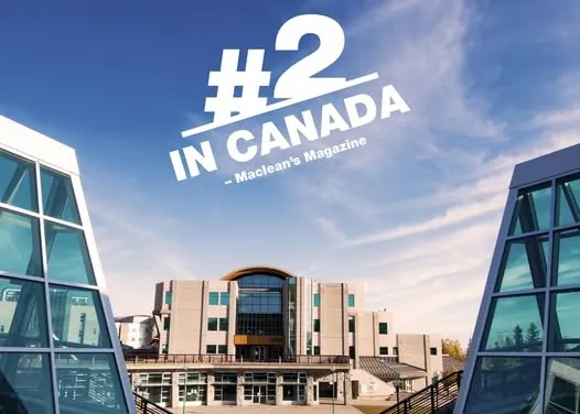 Ground-level view of UNBC Prince George Campus with banner "#2 in Canada - Maclean's Magazine"
