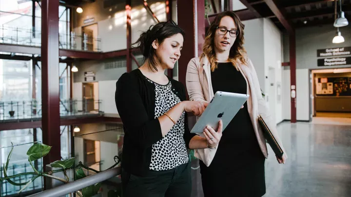 Two women using an ipad