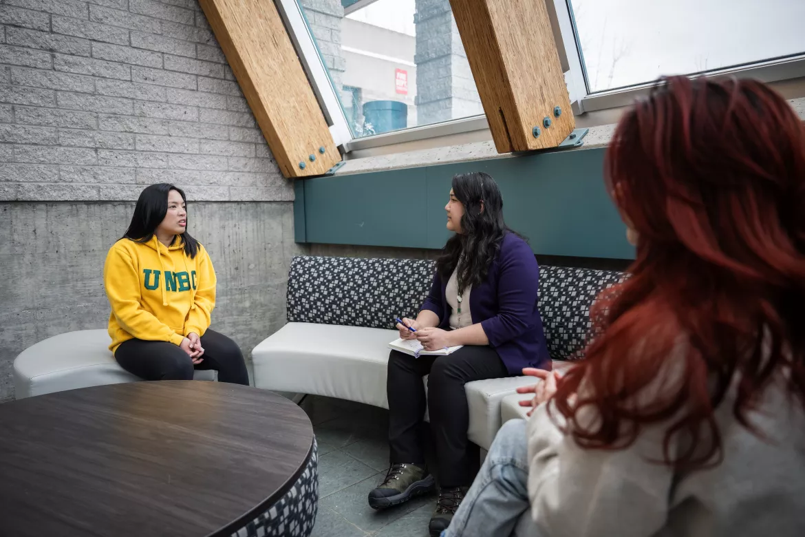 UNBC students sitting together on campus