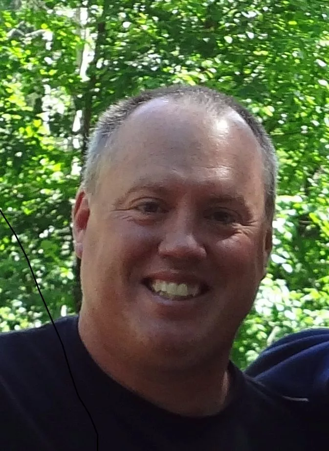 Mike Ramsay with trees in the background