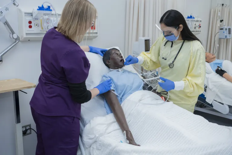 Instructor-Led Simulation instruction with student and Mannequin-patient