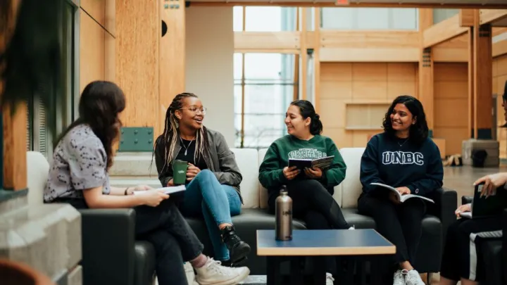 Students gathering discussing course material