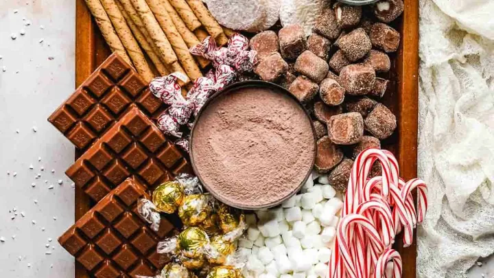 A tray of hot chocolate served with a variety of toppings