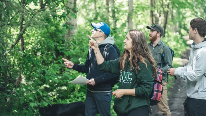 UNBC students learning in the forest