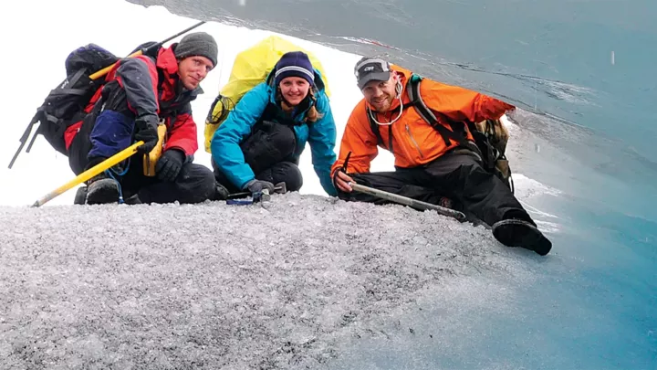 Geography students studying a glacier