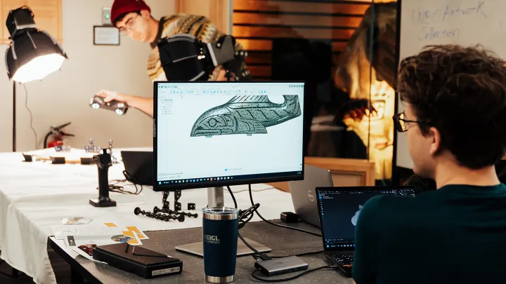 Youth looking at a computer monitor