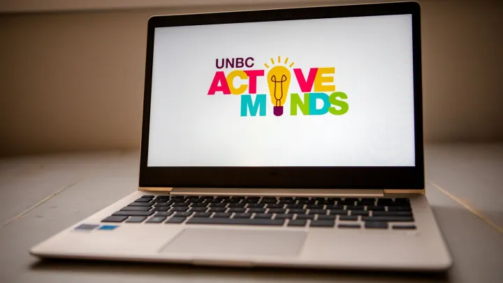 Active Minds logo displayed on a laptop