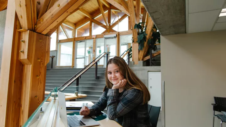 student in study area facing camera