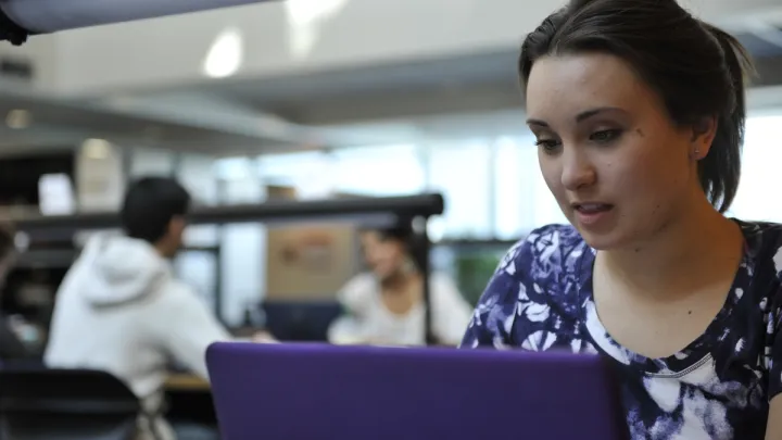 UNBC student using a laptop computer