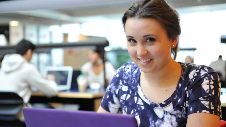 UNBC student on her computer