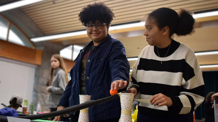 Two youth working on an engineering project