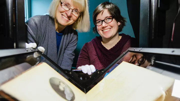 students and instructor in library archives