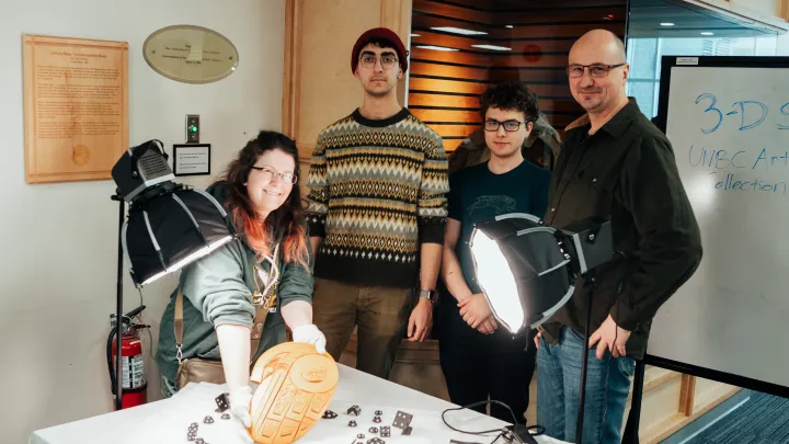 Group of teachers and students in a lab