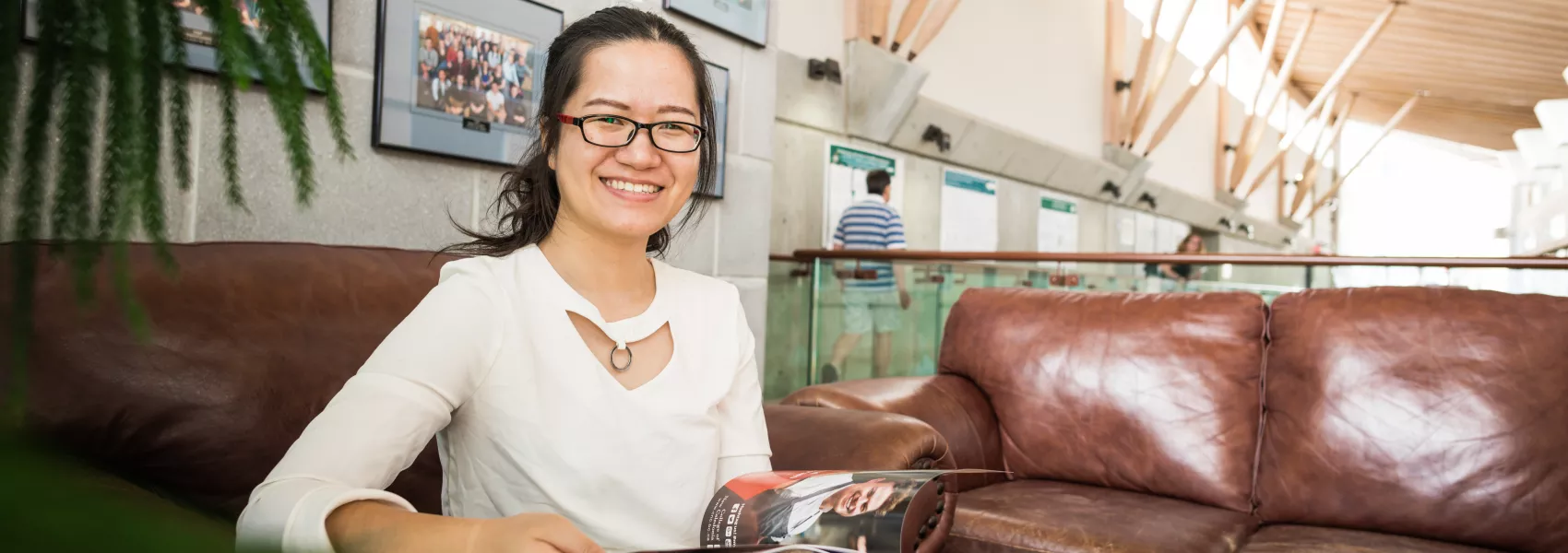 A student leafs through a magazine in the Dr. Donald Rix Northern Health Sciences Centre. 