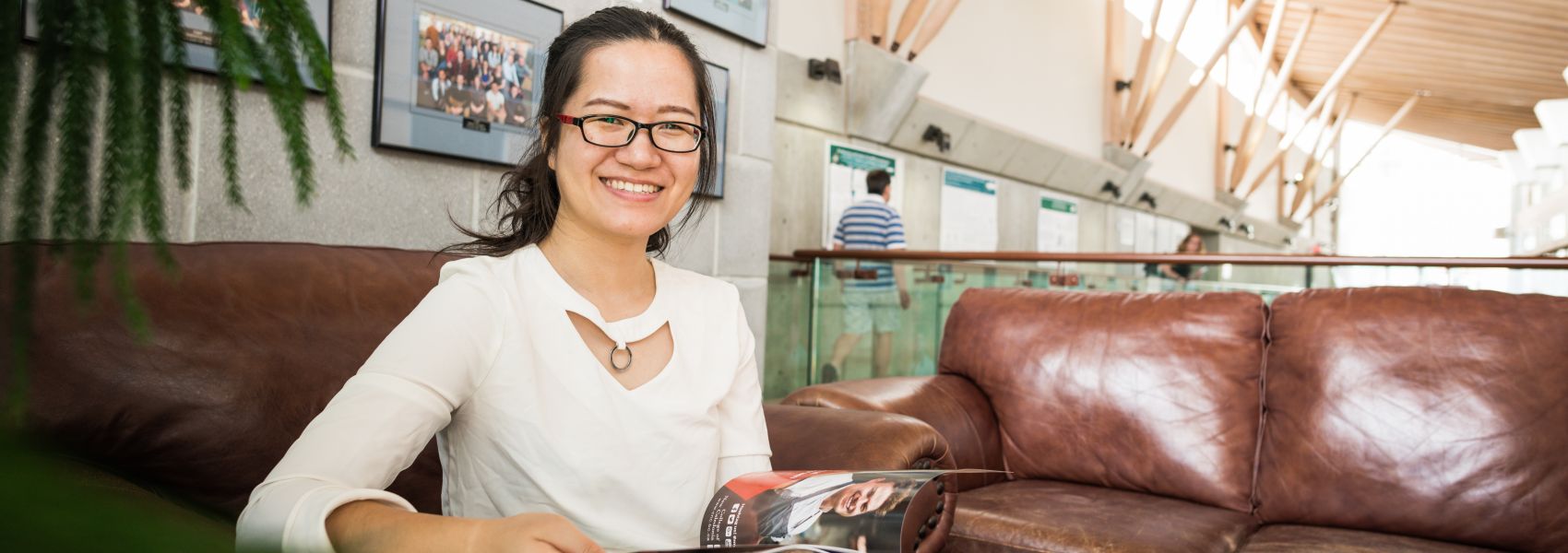 A student leafs through a magazine in the Dr. Donald Rix Northern Health Sciences Centre.