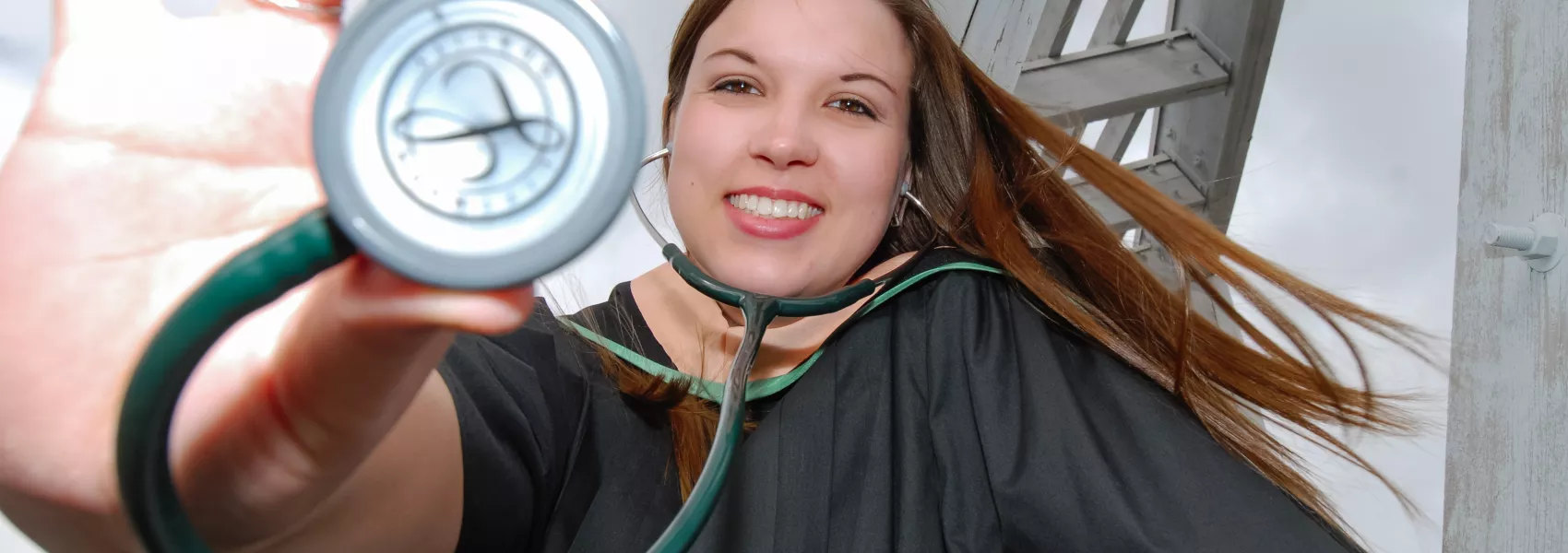 UNBC Nursing Student holding a stethoscope