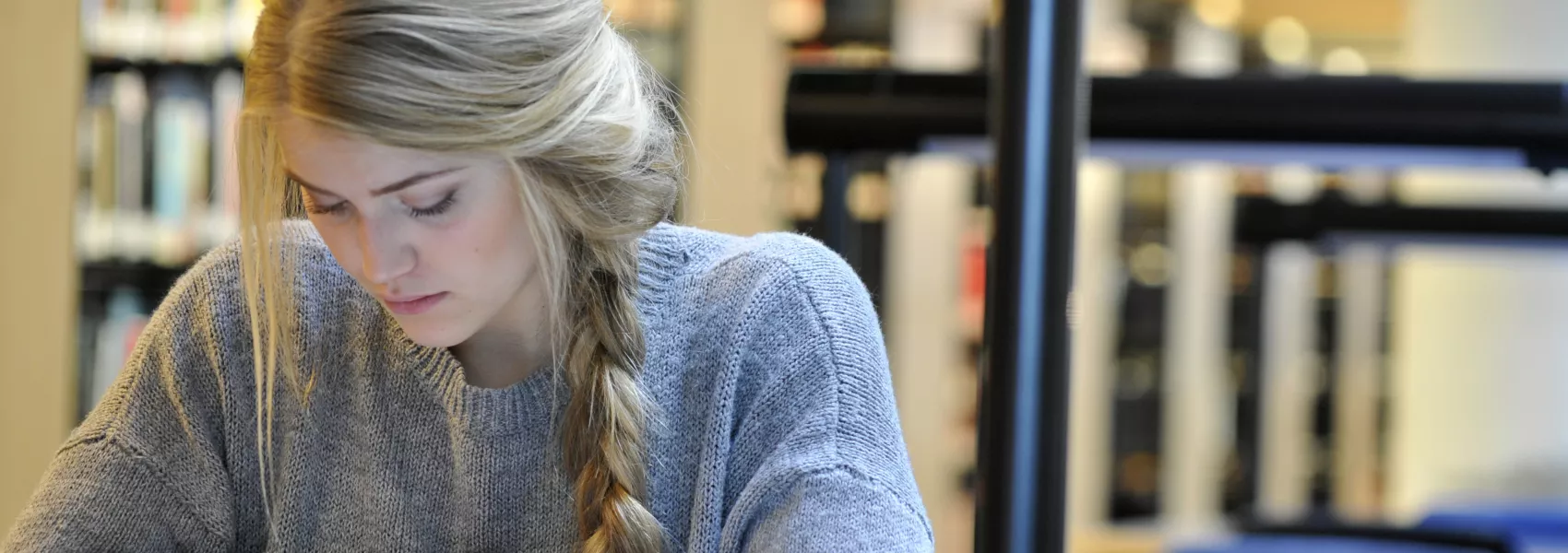 UNBC Psychology Student in the Library